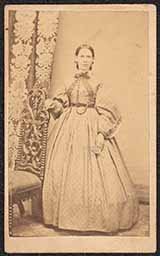 Carte de visite picturing woman in patterned dress. Back of card has printed text "E. WEBB'S/"Union Gallery,"/No. 302 Market Street,/WILMINGTON DEL."