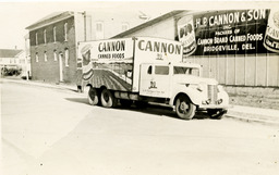 Exterior view of H.P. Cannon and Son, Inc. warehouse in Bridgeville with delivery truck, ca. 1930-1950.