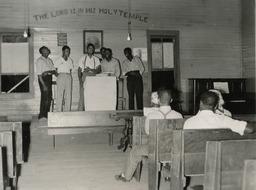 Young men singing in church, ca. 1950s.