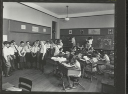 Interior view of an elementary classroom with children doing various activities at the Charles B. Lore School, Wilmington, Del.