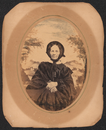 Crayon enlargement of a portrait of a sitting woman in a black dress and bonnet. A mountain scene has been added in the background. From the studio of Wilmington photographer Emily Webb.