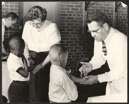 Boys receiving vaccine, undated