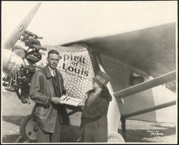 Emily Bissell with Charles Lindbergh in front of his plane, October 22, 1927