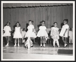 Group of girls dance on stage, circa 1945-1965