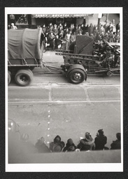 Rooftop view of a defense parade and crowd