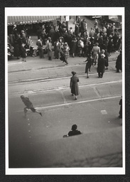 Rooftop view of crowd at a defense parade