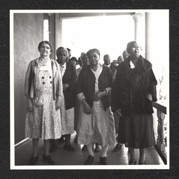 Matron Gertrude Brown (front left) poses with residents