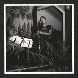 A woman signs on stage