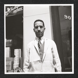 Dr. John L. Davidson, pharmacist, poses outside of the 9th Street Pharmacy