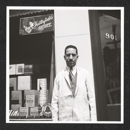 Dr. John L. Davidson, pharmacist, poses outside of the 9th Street Pharmacy