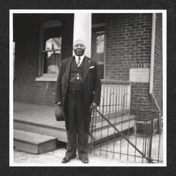 Reverend David H. Hargis poses near a porch