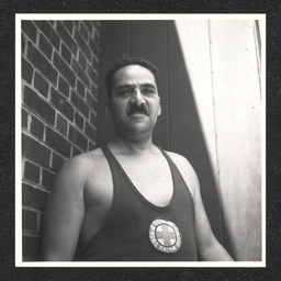 A lifeguard poses outside