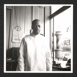 Leonard E. Gaines poses inside his barbershop at 1022 Walnut St. in Wilmington, Delaware.