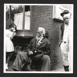 Big August Quarterly, man smiles by crowd, August 27, 1939