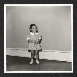 St. Michael's Day Nursery for Colored Children, a girl poses and smiles, 1940