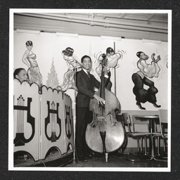 Spot Café, band member in front of mural, March 20, 1940