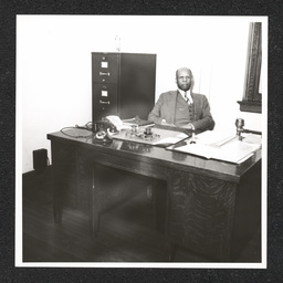 Howard High School 1320 Poplar St., George A. Johnson (principal) at desk, 1940