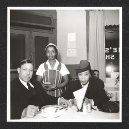 Elsie's Chicken Shack 1200 Walnut St., Elsie Justice with customers, 1940