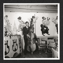 Spot Café, band member in front of mural, March 20, 1940