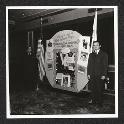 Aldine Theater, two men stand by display for the Wilmington Clippers football team, June, 1940