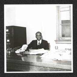 Howard High School 1320 Poplar St., Joseph Anderson Morris at desk, 1940