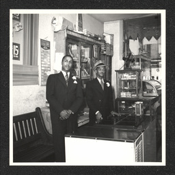 Kids' Shop 9th Lombard St., owners poses inside store, 1938-40