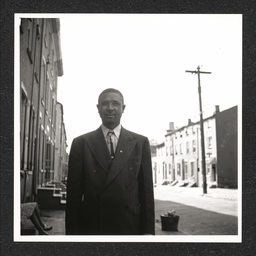 Johnson's Liquor Store 528 Lombard St., Charles Johnson poses outside store, 1940