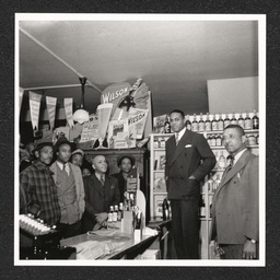 Johnson's Liquor Store 528 Lombard St., Charles Johnson with crowd in store, 1940