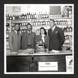 Johnson's Liquor Store 528 Lombard St., print 1 of 2, Charles Johnson and wife with two others, 1940