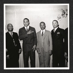 Johnson's Liquor Store 528 Lombard St., four men pose, 1940