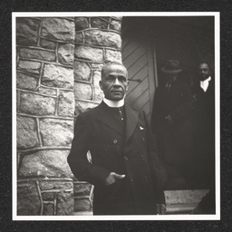 Reverend A. Chester Clark, Bethel A.M.E. Church 602 Walnut St., posing near front door, January 2, 1939