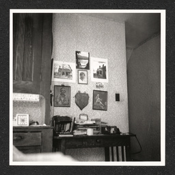 Szymanski Home 236 Lombard St., shots of desk and wall of images, 1939, print 2 of 2