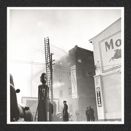 H. Feinberg Furniture Co. 808 King St., street level view of fire being put out, 1940