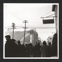 H. Feinberg Furniture Co. 808 King St., crowd watches fire being put out, 1940