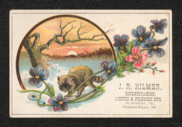 Trade card printed for J.R. Kilmer, an undertaker and embalmer in Wilmington. The back of the card has a child's writing practice written in pencil.