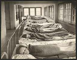 Children sleeping in hospital beds, undated