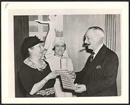 Al Smith receiving Christmas seals from Emily Bissell, 1939