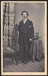 Carte de visite, Man in Suit with Blue Bowtie and Posing Chair
