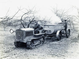 Caterpillar tractor and sprayer in Townsend Orchards, Selbyville, Del., April 4, 1931