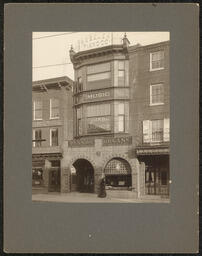 Gelatin silver print of the exterior of the Robelen Piano Company in Wilmington, Delaware. Mounted on gray board.