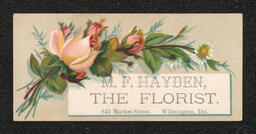 Trade card printed for M.F. Hayden, a florist in Wilmington. The design on the front shows a bouquet of flowers surrounding a smaller inset card where the business information is printed.
