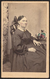 Carte de visite, Woman sitting with Colored Flowers, front