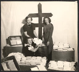 Three women with bags of letters, undated