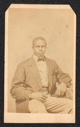 Photograph, Seated man wearing bow tie, front