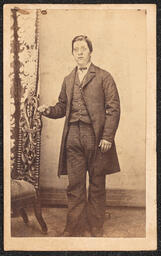 Carte de visite, Defaced photograph of Man with Posing Chair, front