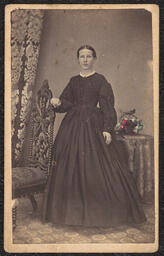 Carte de visite, Woman in Black Dress with Flower Basket, front