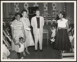 Mrs. Rothwall, Mrs. Lewis, and Bishop Mosley with children, 1957