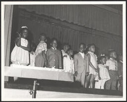 Group of children performing on stage at St. Michael's, circa 1945-1965