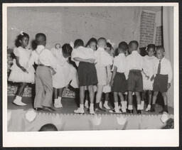 Children dance on stage at St. Michael's Nursery School.
