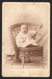 Cabinet Card, Baby sitting on a Wicker Chair